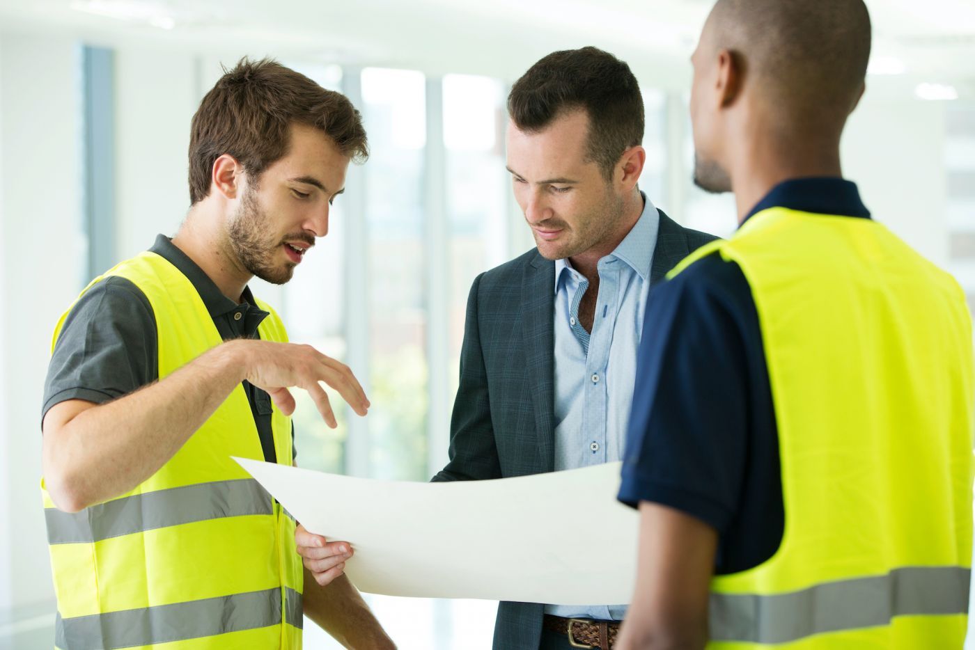 Builder discussing plans with architect